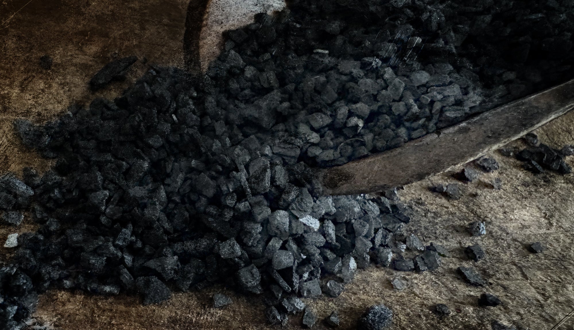 Close-up of black salt on a wooden surface